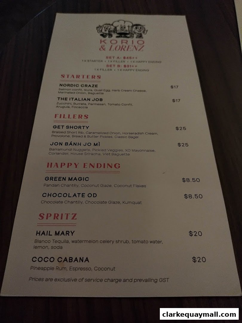 A menu for Korio & Lorenz featuring starters, fillers, happy endings, and spritz cocktails.