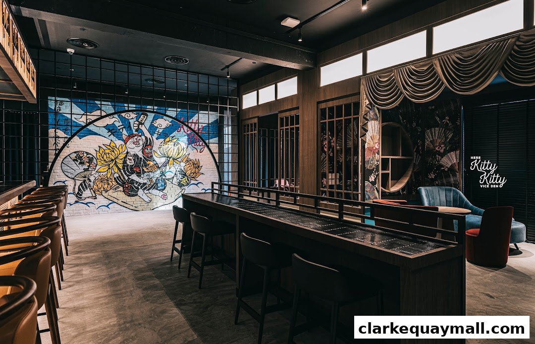 Interior of a stylish cocktail lounge with a bar, seating, and a large mural.