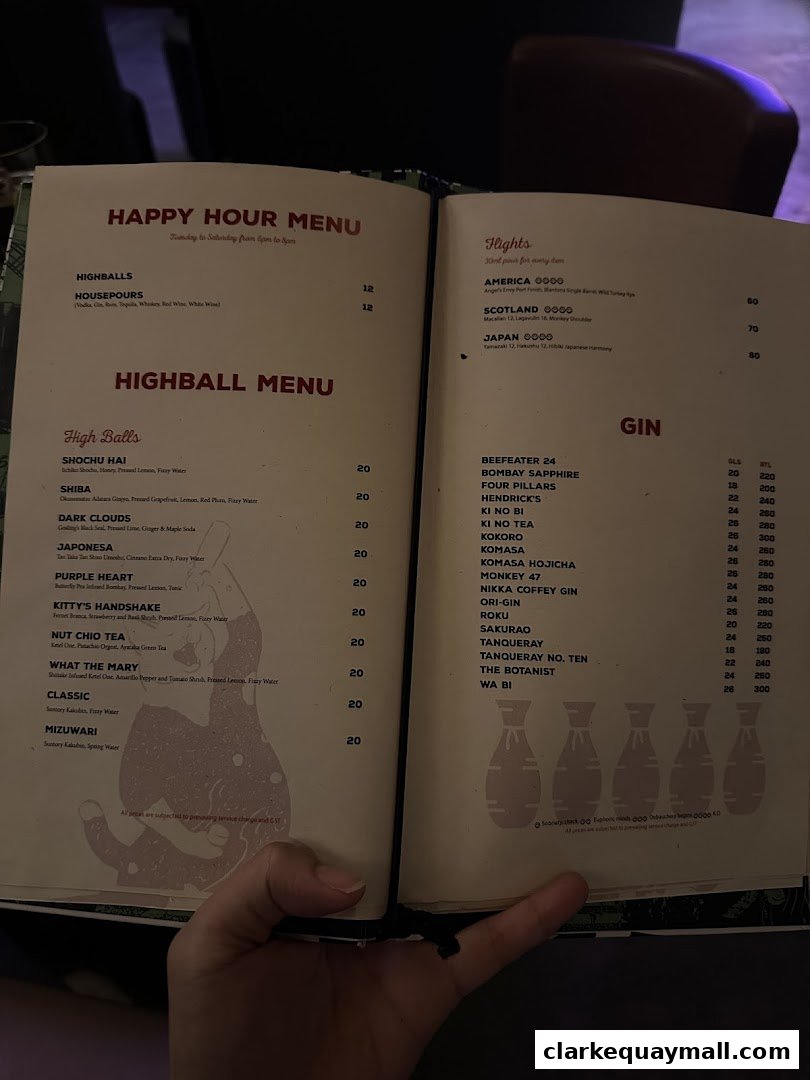 An open menu for a cocktail lounge, featuring highballs and gin selections.