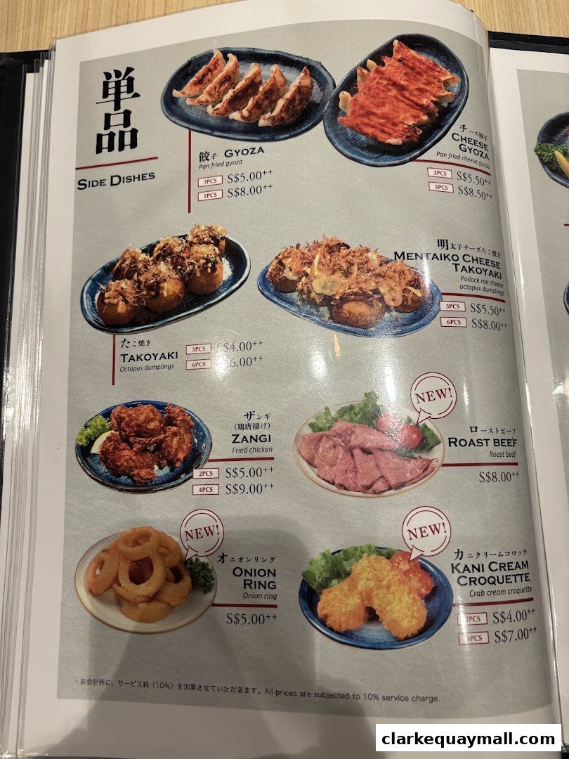 A menu page from Hokkaido Ramen Santouka featuring various side dishes like gyoza, takoyaki, and fried chicken.