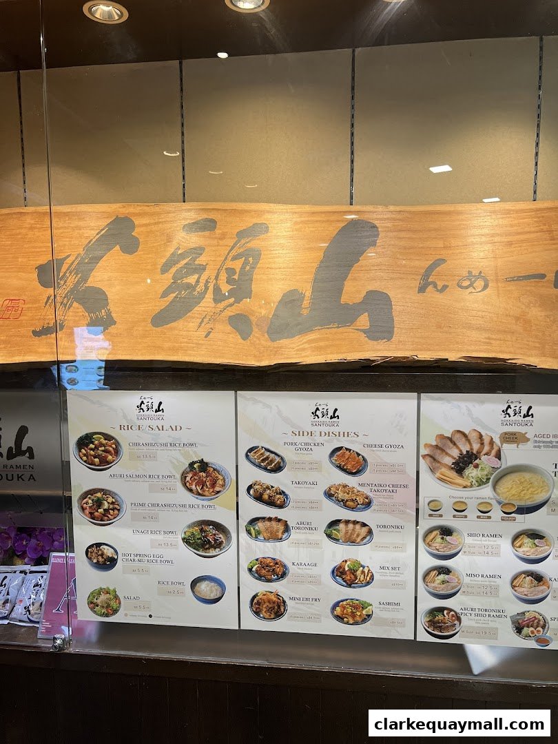 A menu display for Hokkaido Ramen Santouka, showcasing various ramen, rice bowls, and side dishes.