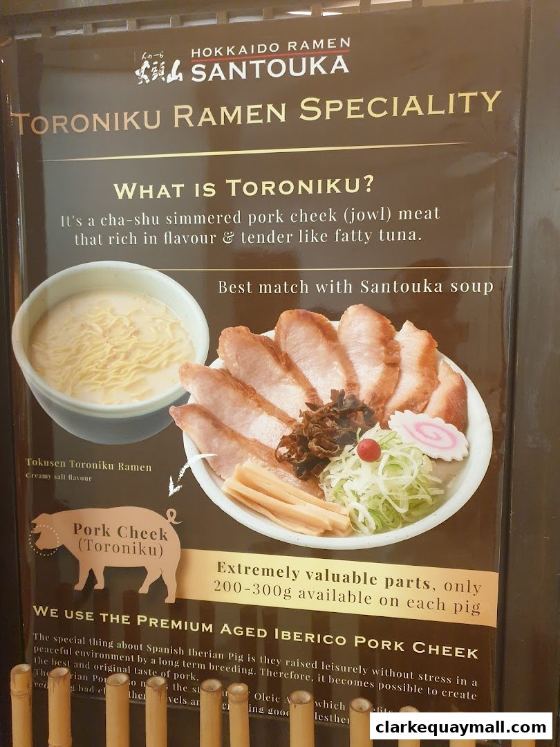 A menu board showcasing Hokkaido Ramen Santouka's Toroniku Ramen speciality.