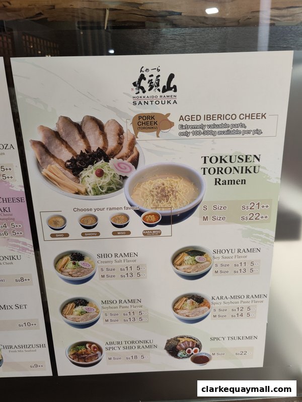 A menu board for Hokkaido Ramen Santouka, showcasing various ramen dishes and their prices.