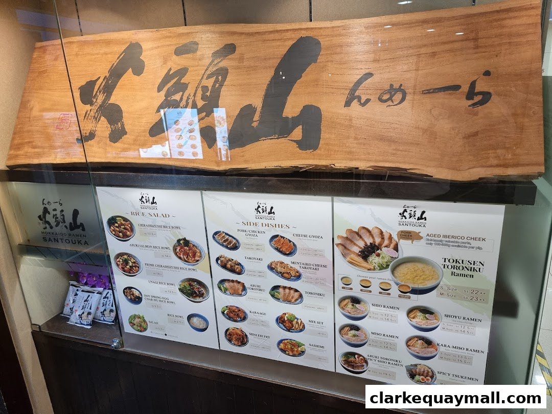 A display menu for Hokkaido Ramen Santouka, showcasing various ramen, rice bowls, and side dishes.