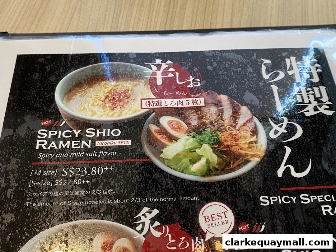 A menu featuring Spicy Shio Ramen with Toroniku pork and a description of noodle portion.