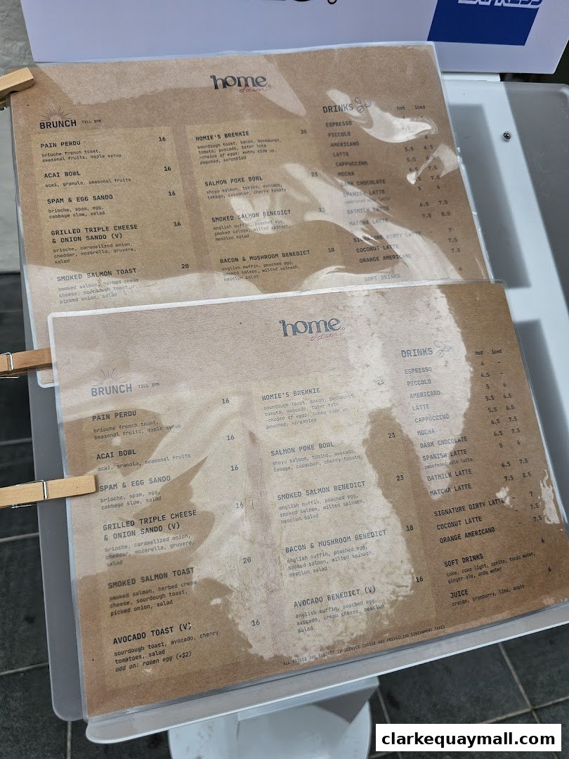 A close-up view of two menus from Home Dawn Cafe, showcasing brunch and drinks.