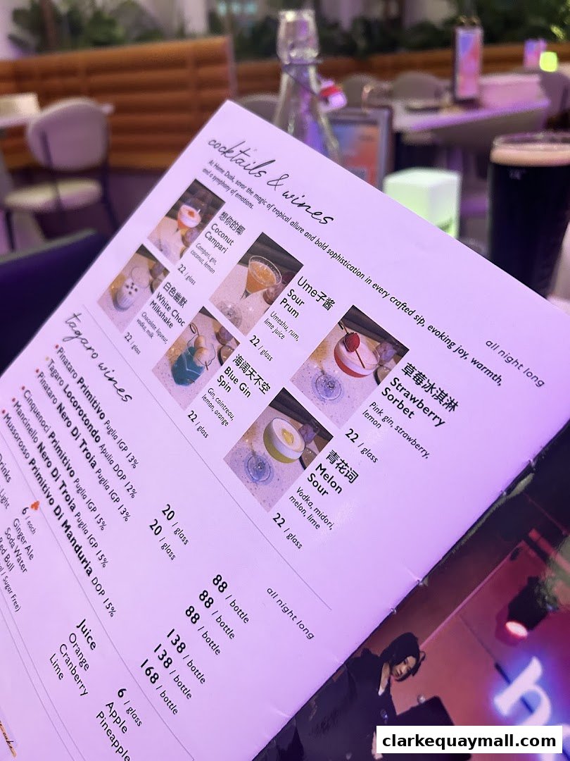 A menu featuring cocktails, wines, and juices with accompanying images.