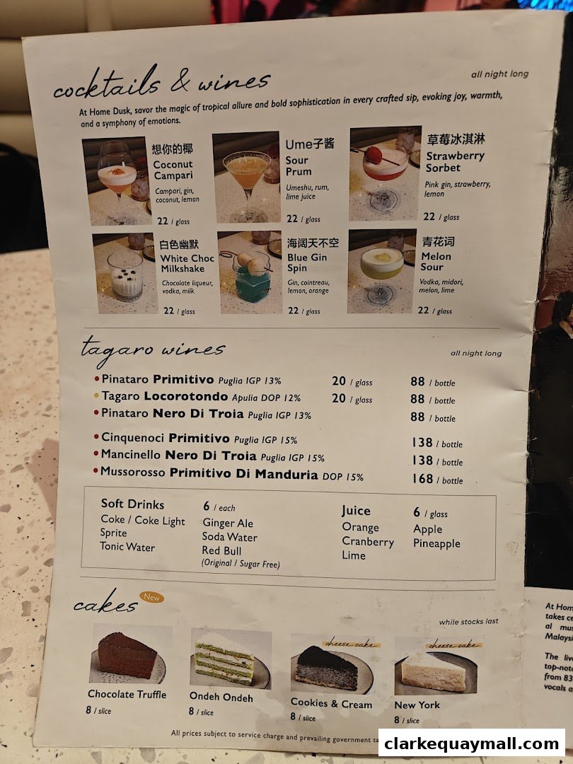 A menu featuring cocktails, wines, soft drinks, juices, and cakes with prices and descriptions.