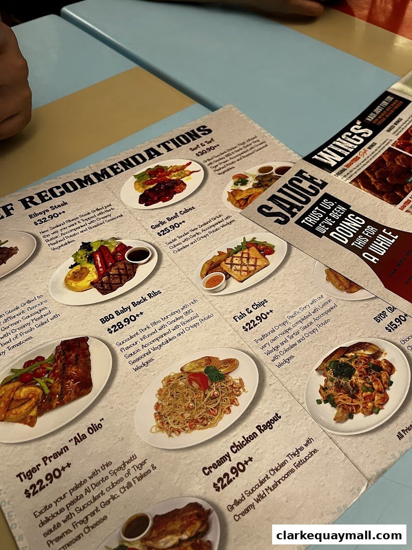 A menu featuring various dishes with descriptions and prices, including steaks, ribs, pasta, and fish.