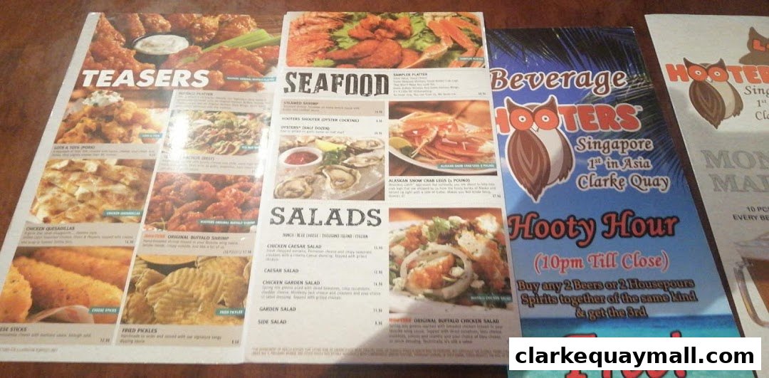 A Hooters menu featuring appetizers, seafood, and salads, with a Hooty Hour promotion.
