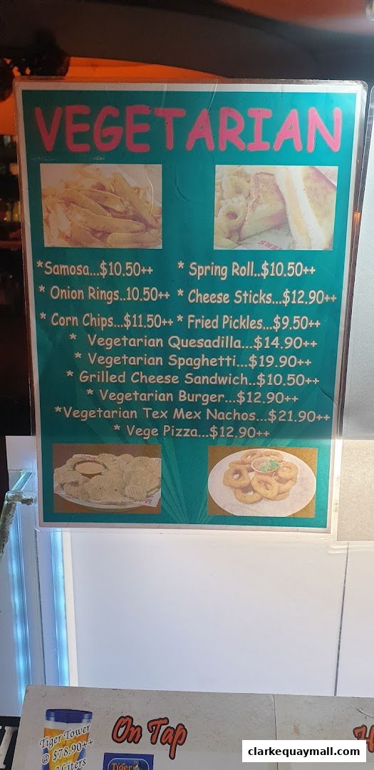 A menu board displaying various vegetarian food items with prices and images.
