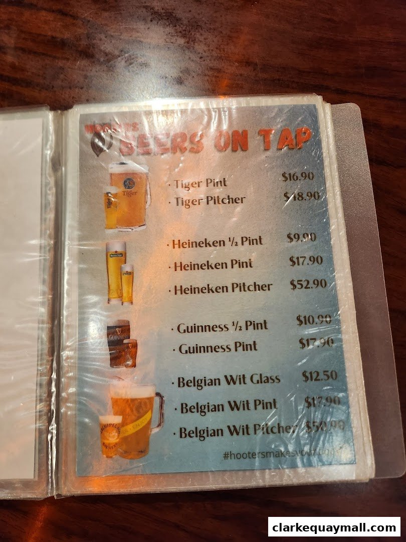 A menu page from Hooters showcasing various beers on tap with prices.