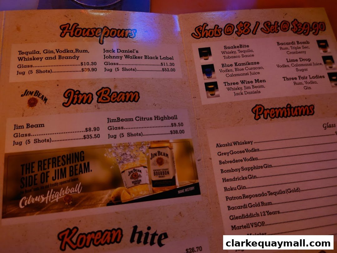 A menu page featuring drinks, including house pours, shots, and premium spirits, with Jim Beam promotions.