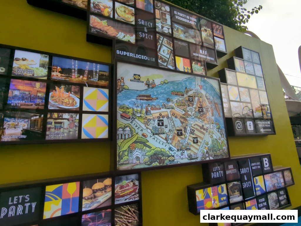A yellow wall adorned with various framed pictures and a map of Singapore.
