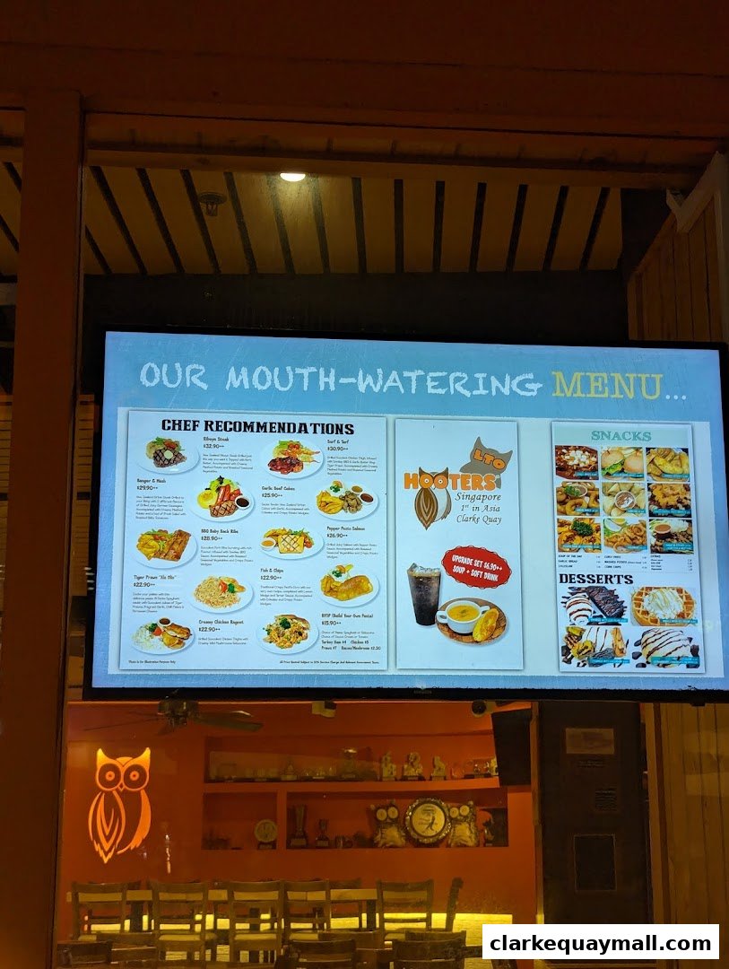 A menu board displaying Hooters' chef recommendations, snacks, and desserts.