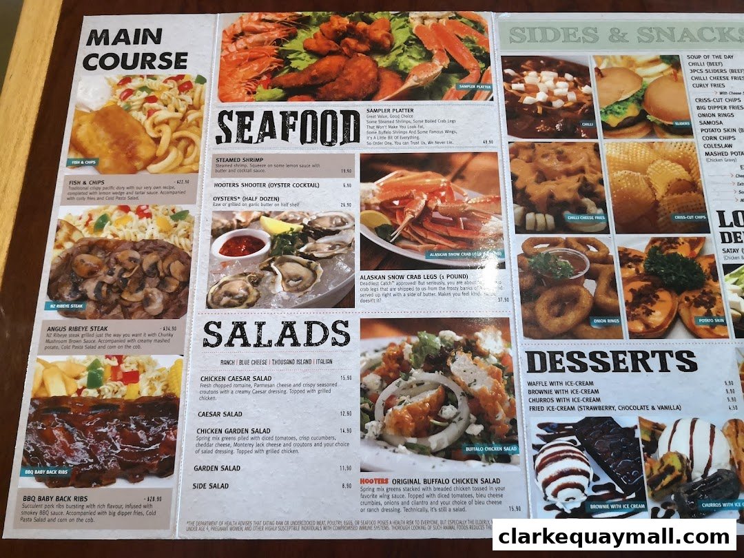 A menu from Hooters featuring main courses, seafood, salads, sides, snacks, and desserts.