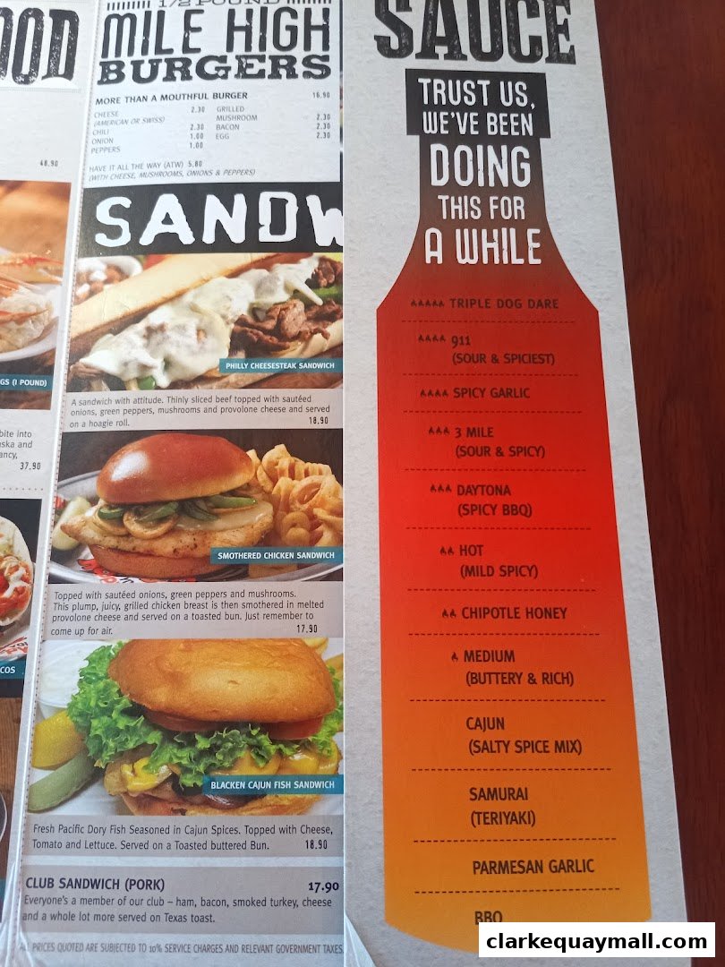 A menu featuring burgers, sandwiches, and a variety of sauces with heat levels.