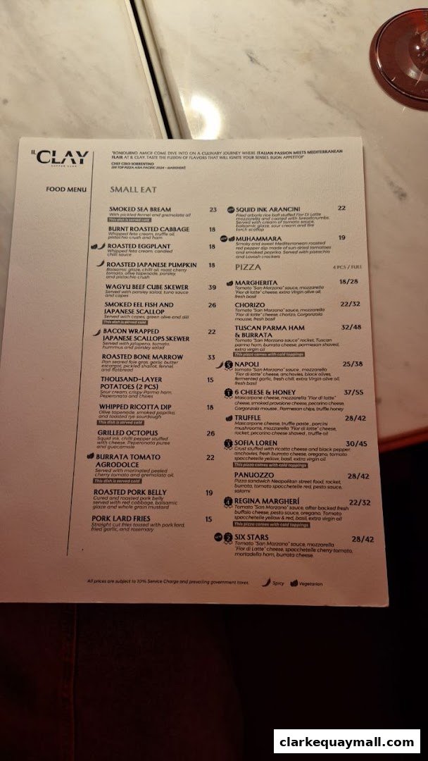 A menu from IL CLAY Clarke Quay featuring small eats and pizzas with prices.