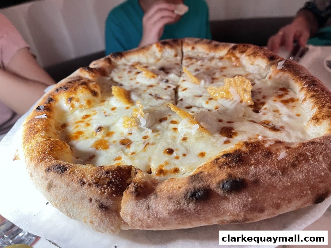 A close-up shot of a delicious white pizza with melted cheese and crispy crust.