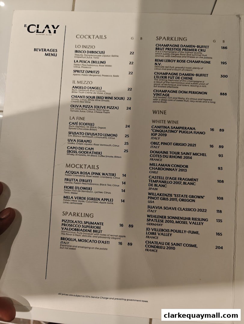 A menu from IL CLAY Supper Club featuring cocktails, mocktails, and sparkling wines.