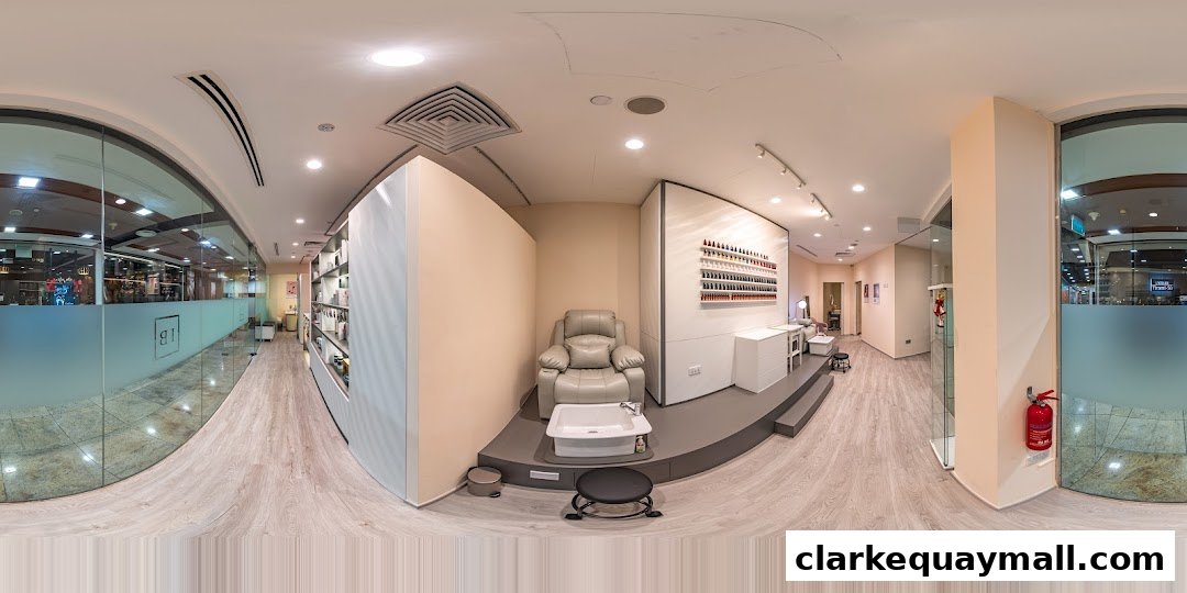 Interior view of a modern beauty salon with nail polish displays and a pedicure station.