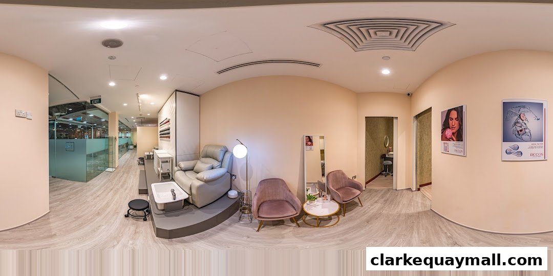 Interior view of a modern beauty salon with pedicure chairs, seating, and product displays.
