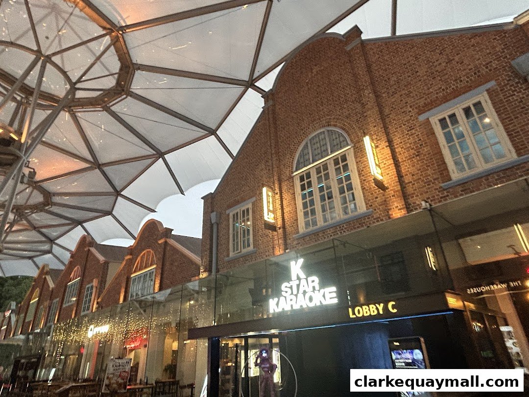Exterior view of K Star Karaoke and Lobby C with brick buildings and a modern canopy.