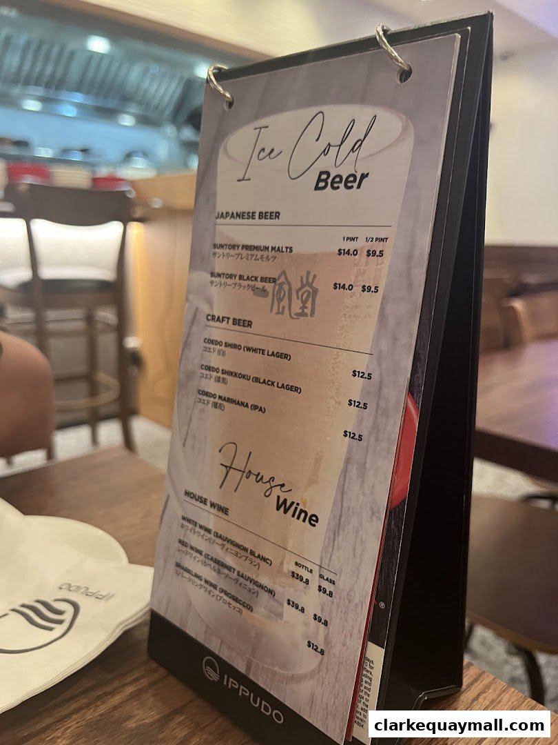 A menu for IPPUDO featuring Japanese and craft beers, and house wines.