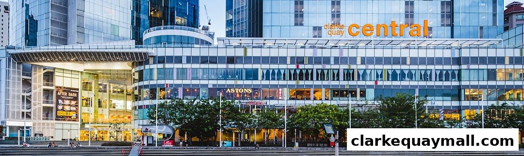 A wide shot of the Central Clarke Quay building with multiple shops and restaurants visible.