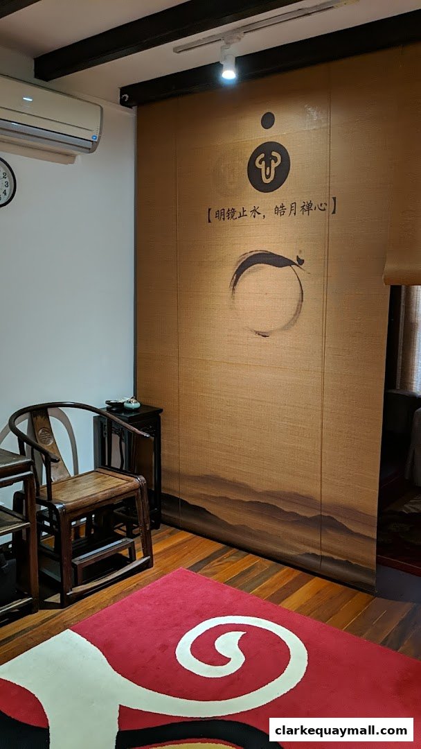 Interior shot of J-Sun Health Management with traditional chairs and a decorative screen.
