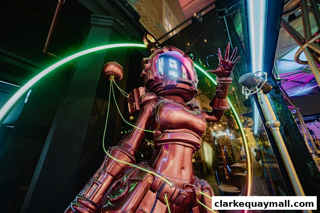 A metallic robot statue with neon lights and a microphone in a vibrant setting.