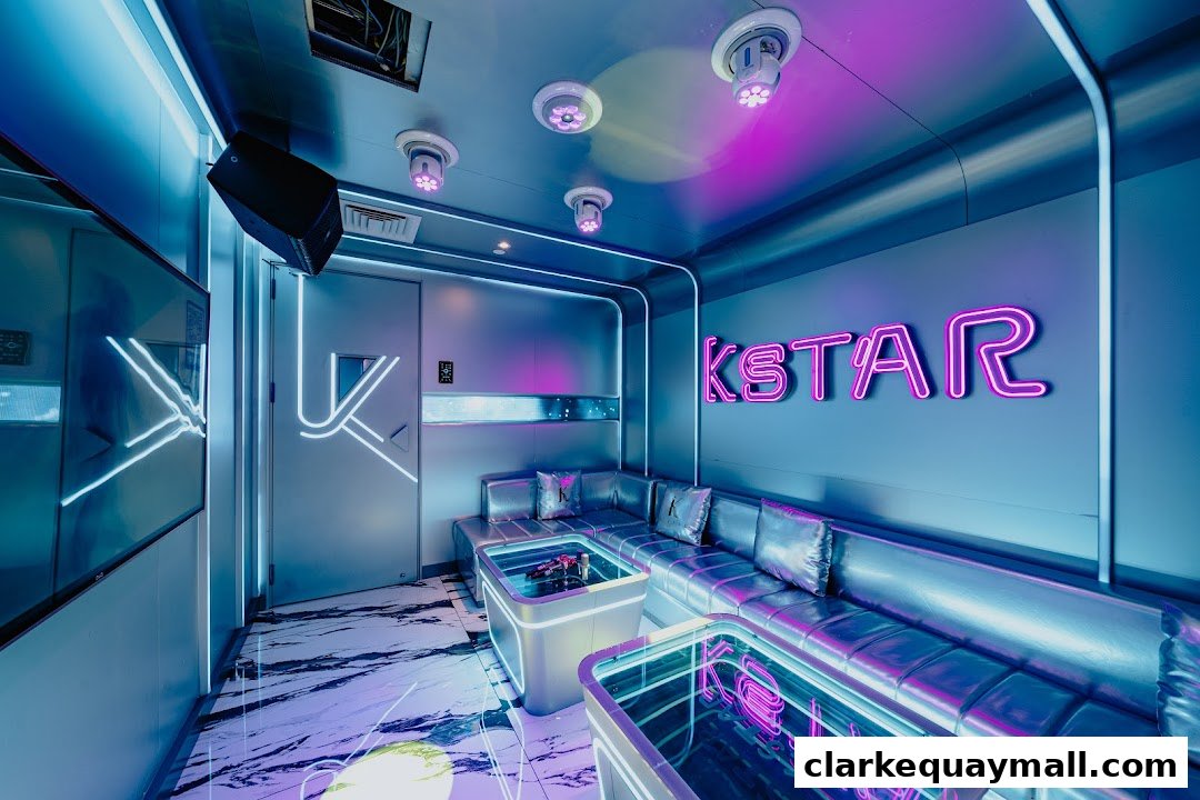 A modern, neon-lit karaoke room with plush seating and a sleek design.