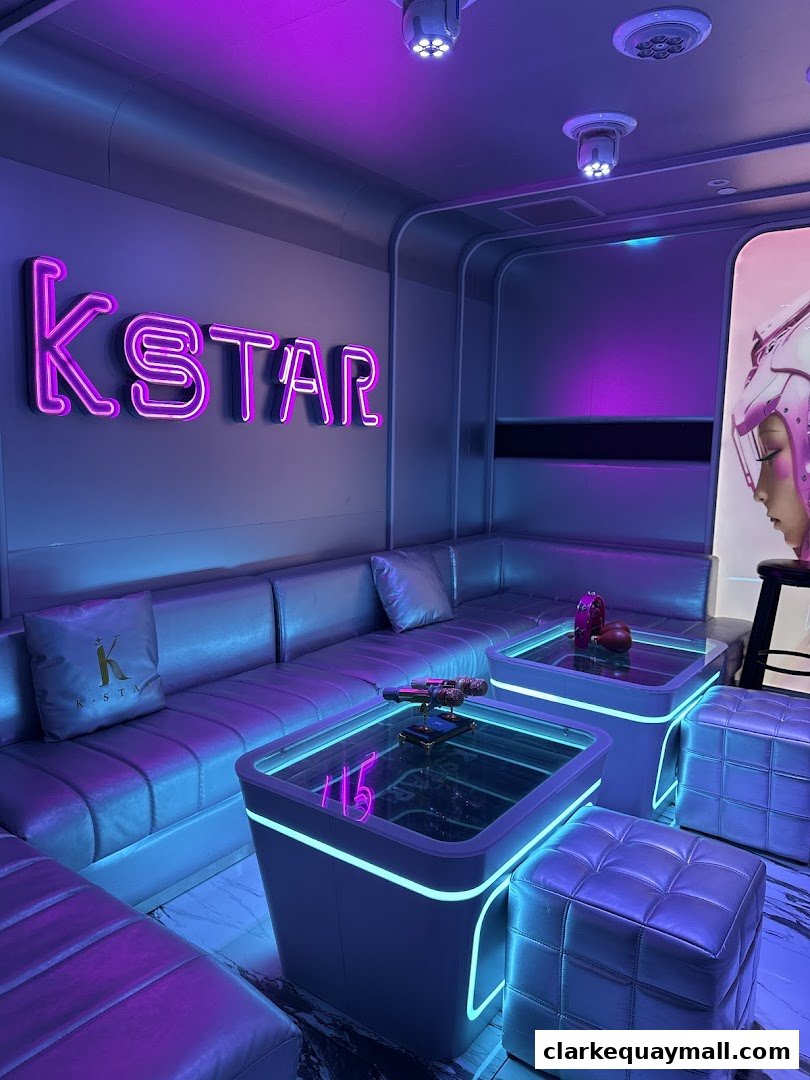 A stylish lounge area with neon signage, plush seating, and modern tables illuminated by purple and blue lights.