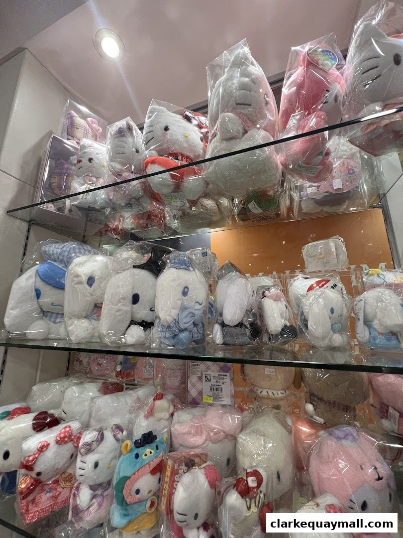 Shelves filled with various Sanrio character plush toys, including Hello Kitty and Cinnamoroll.