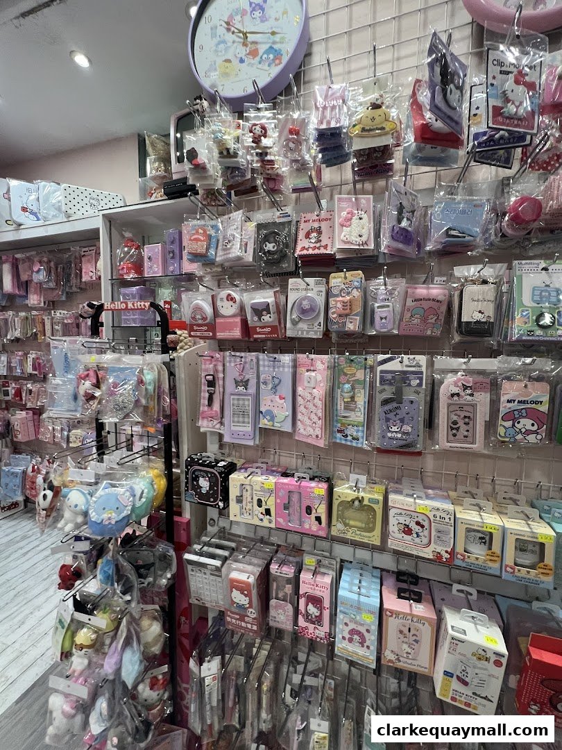 A retail shop interior filled with various Sanrio character merchandise, including Hello Kitty and My Melody.