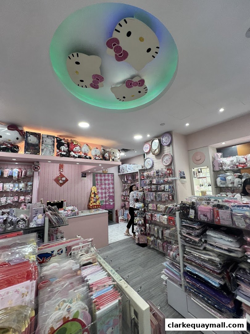 Interior of a brightly lit gift shop filled with Hello Kitty merchandise and accessories.
