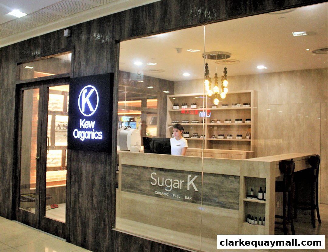 The exterior of Kew Organics Facial Bar, a skincare shop with a modern interior.
