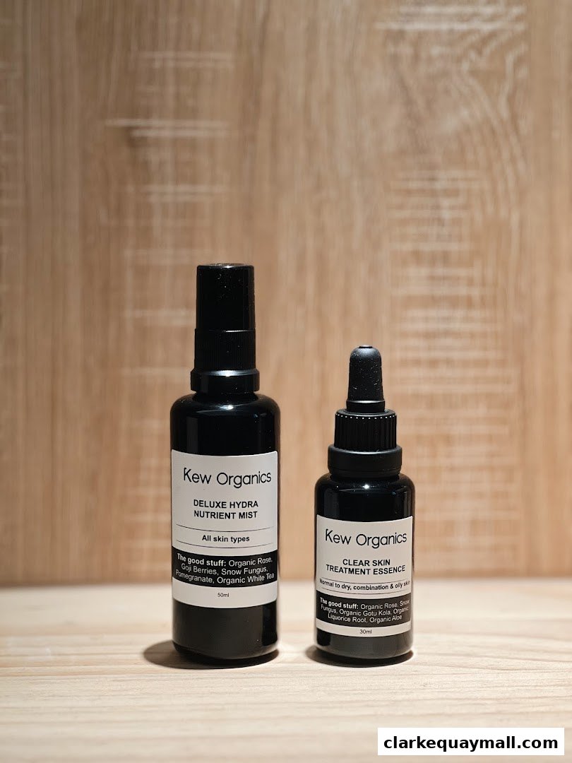Two bottles of Kew Organics skincare products, a nutrient mist and a treatment essence.