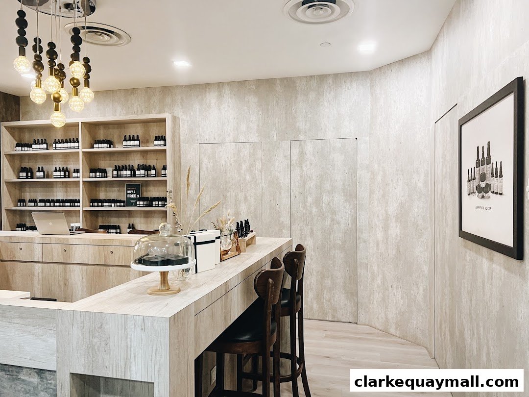 Interior of a modern skincare shop with shelves of products and a counter.