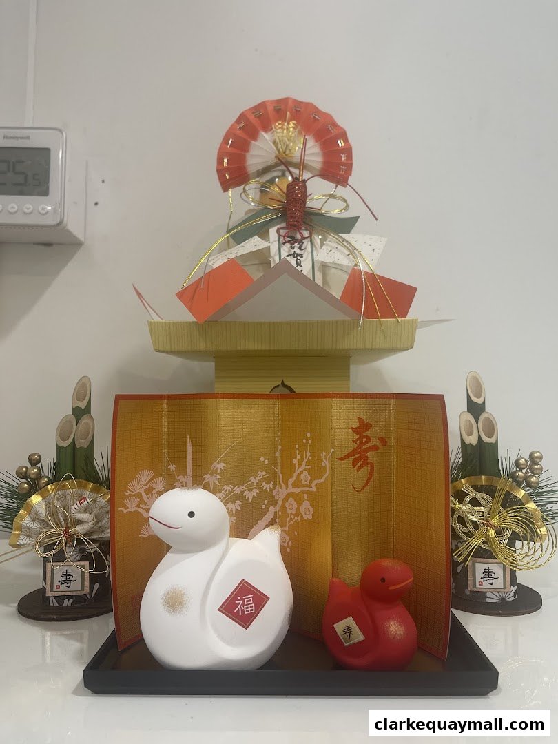 Decorative Japanese New Year ornaments featuring white and red duck figures and traditional festive elements.