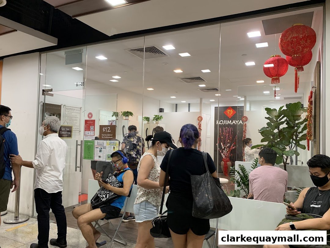 People waiting outside a hair salon with the KOJIMAYA logo visible.