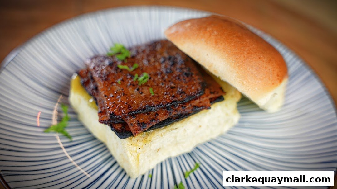 A close-up of a delicious-looking slider with grilled meat and a soft bun on a patterned plate.