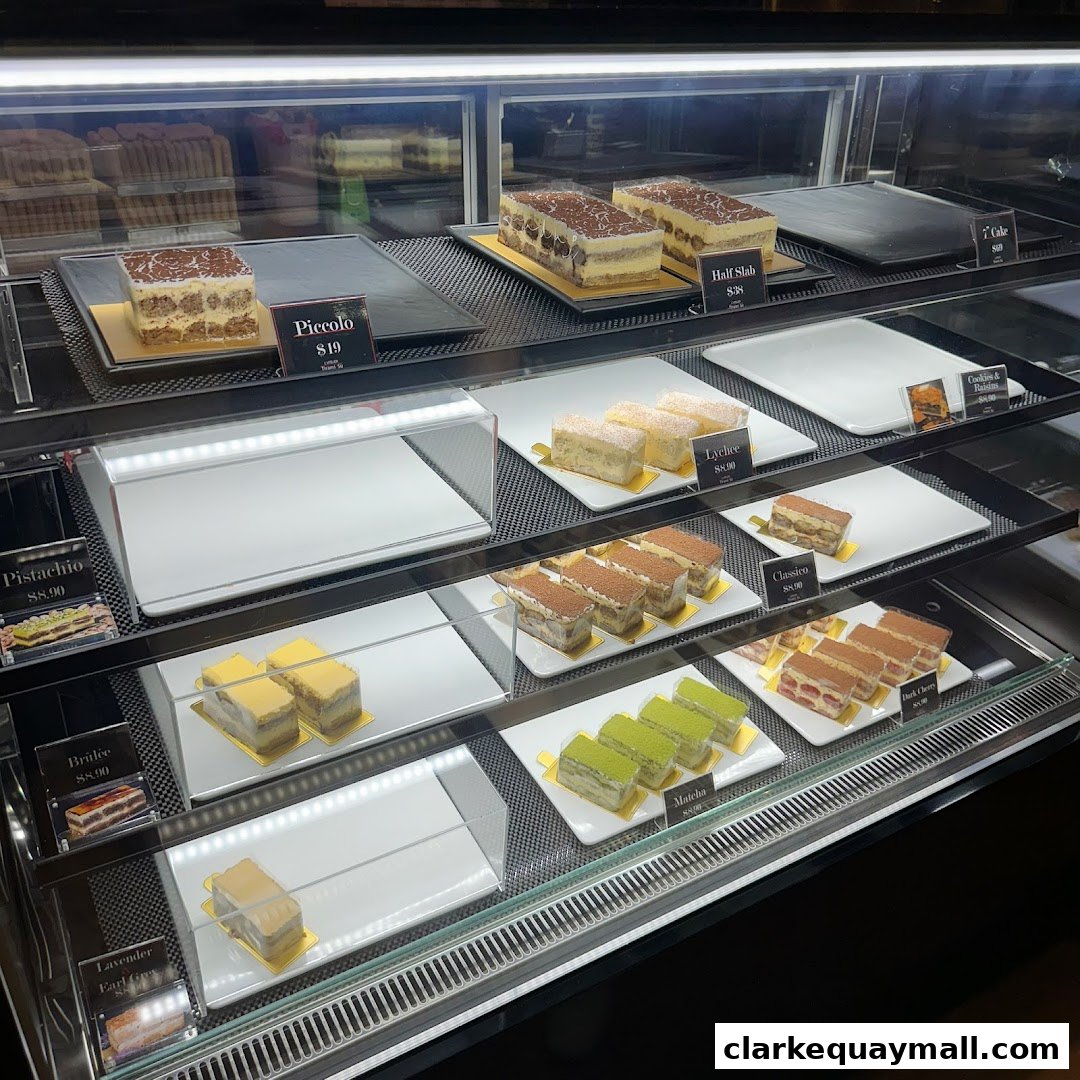 A display case filled with various delicious-looking cakes and desserts.