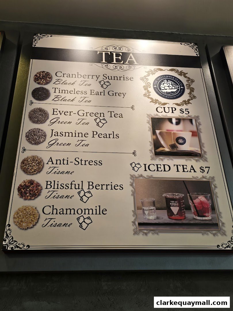 A menu board displaying various tea options with prices and images.