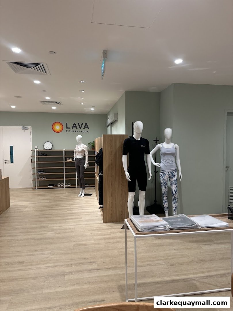 Interior of LAVA Fitness Studio with mannequins displaying activewear and shelves with shoes.