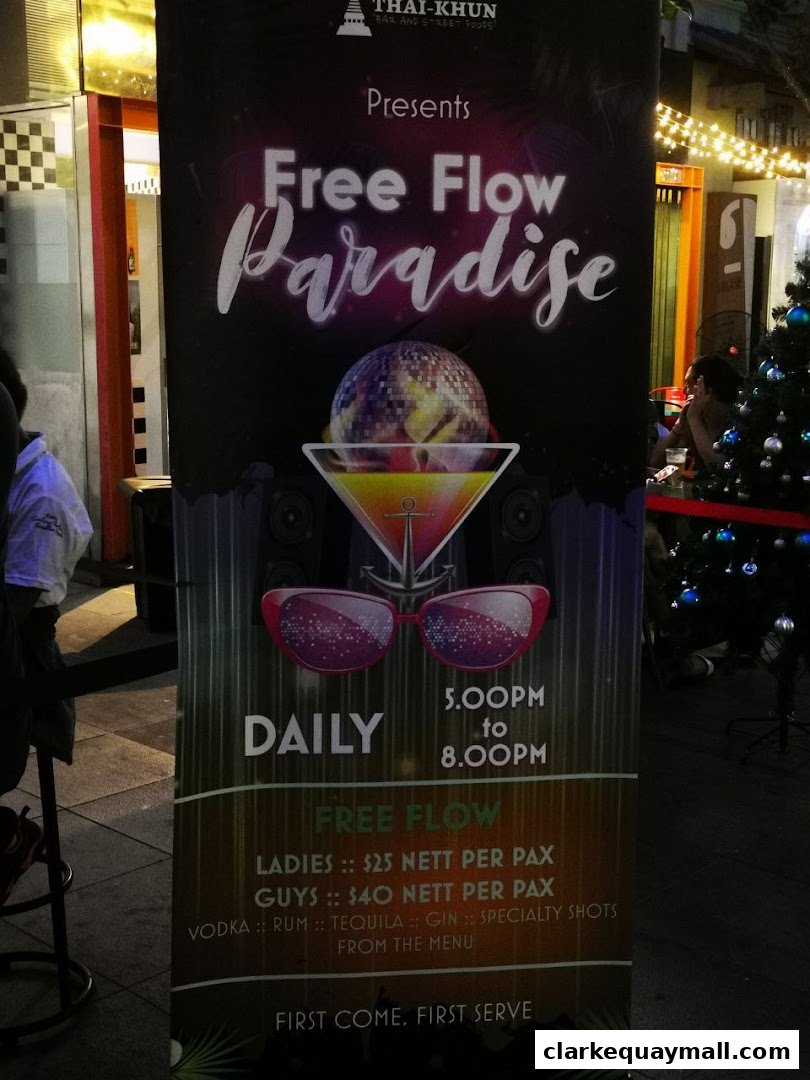 A promotional banner for 'Free Flow Paradise' offering daily drinks from 5 PM to 8 PM.