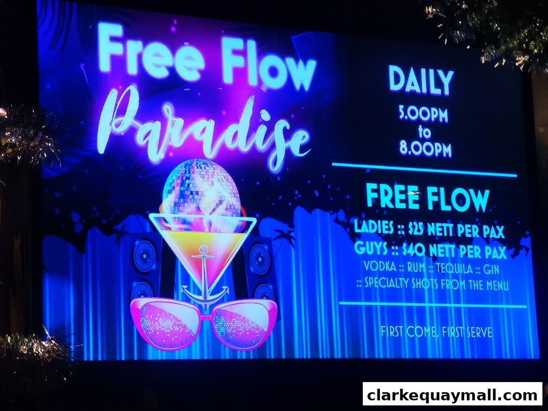 A neon sign advertises a 'Free Flow Paradise' event with drink specials and timings.