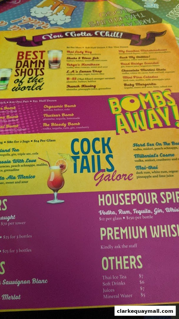 A menu featuring various shots, cocktails, house pour spirits, and other drinks with prices.