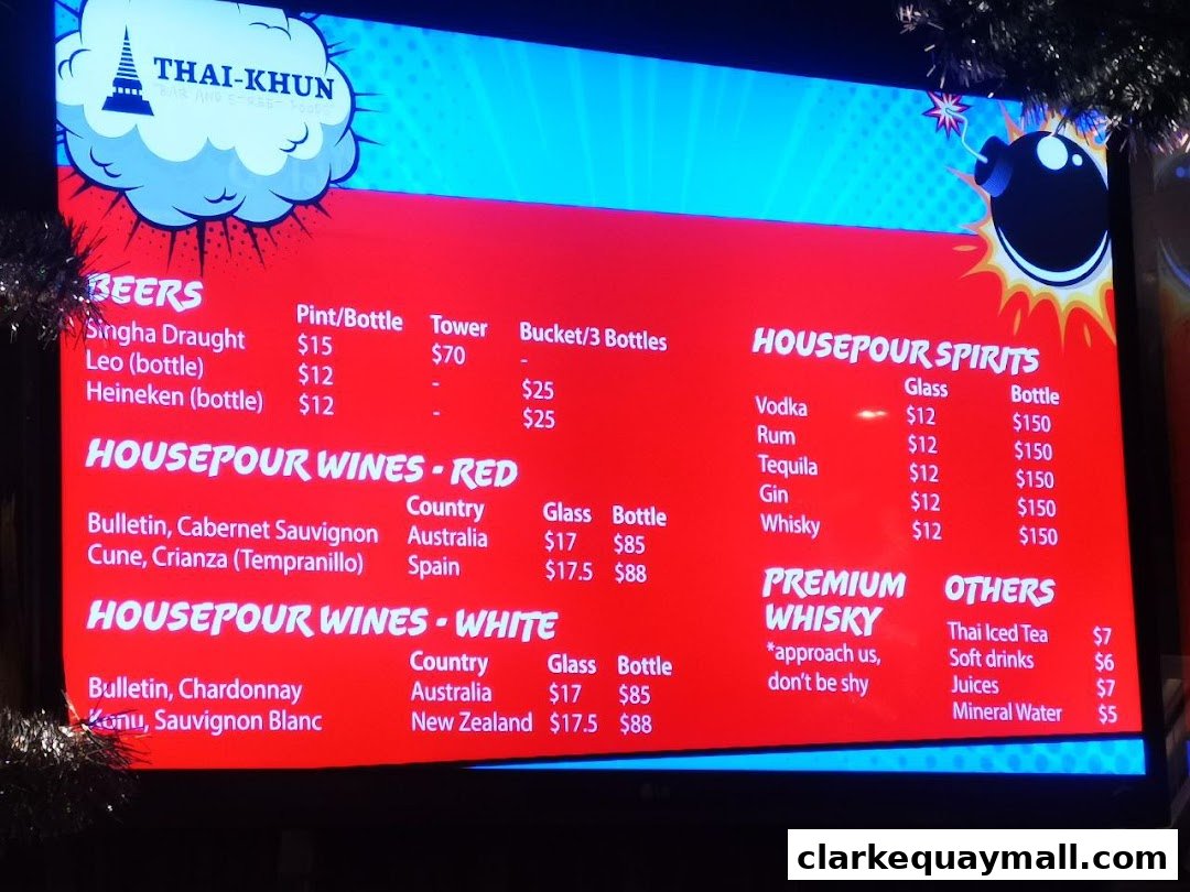 A digital menu board displaying drinks and prices for Thai-Khun Bar.
