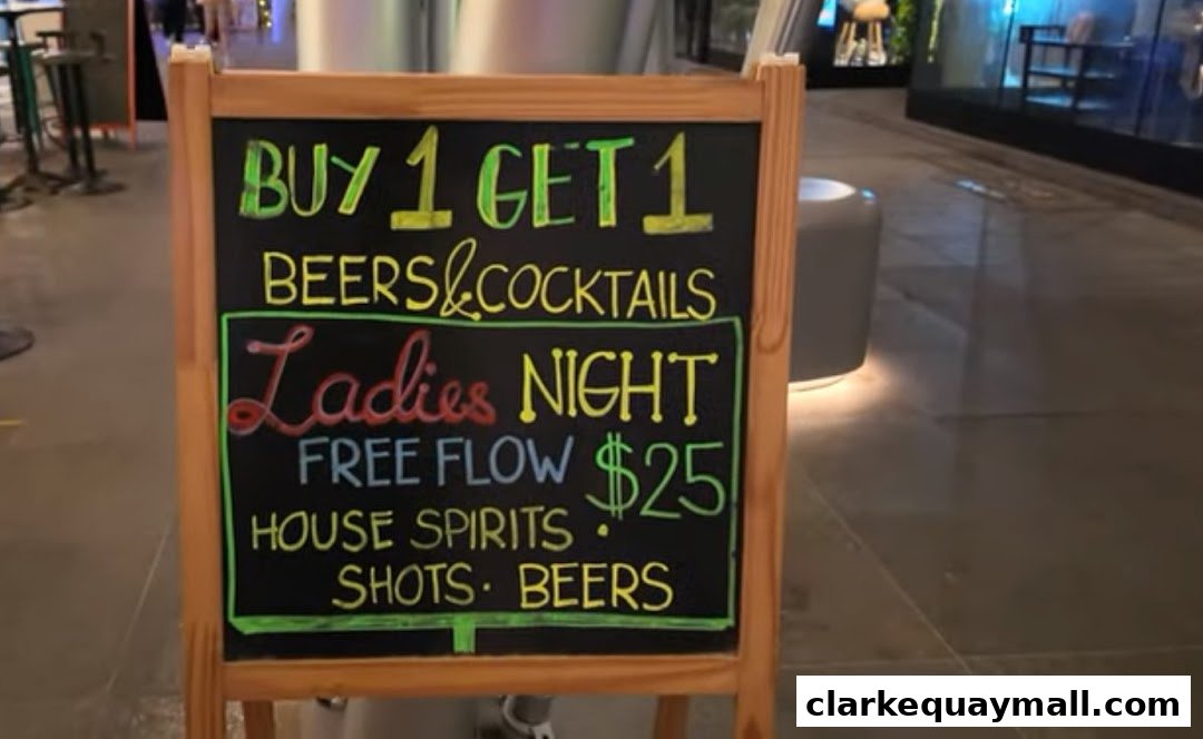 A chalkboard sign advertises a Buy 1 Get 1 deal on beers and cocktails for Ladies Night.